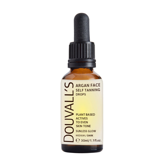 Douvalls Beauty Argan Oil Self Tanning Face Drops in 30ml, dark self-tanning body spray with argan oil, visible dark tint in the bottle.