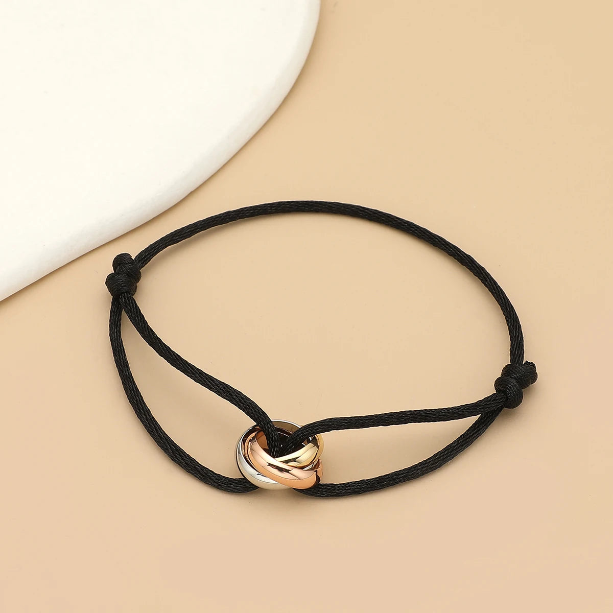 Simple unisex bracelet by Jelieora Venture featuring three metal round circles on adjustable rope bracelet for men and women jewelry.