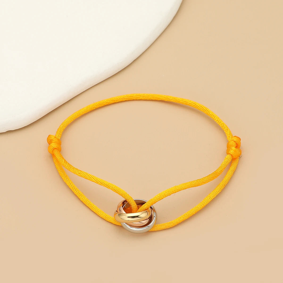 Unisex Jelieora Venture bracelet with three metal round circles, adjustable rope design, suitable for men and women jewelry.