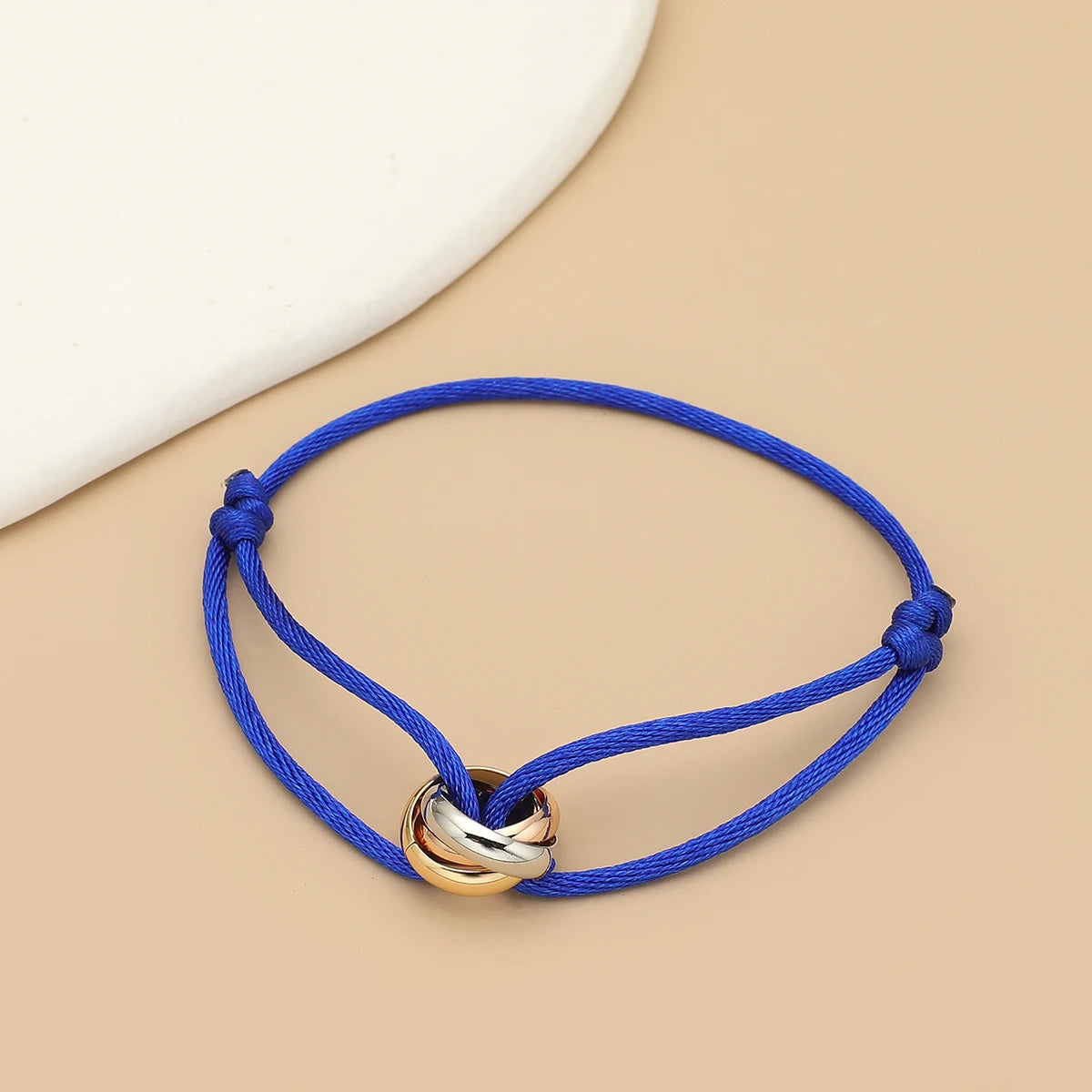 Simple fashion unisex bracelet by Jelieora Venture with three metal round circles on adjustable rope for men and women jewelry.