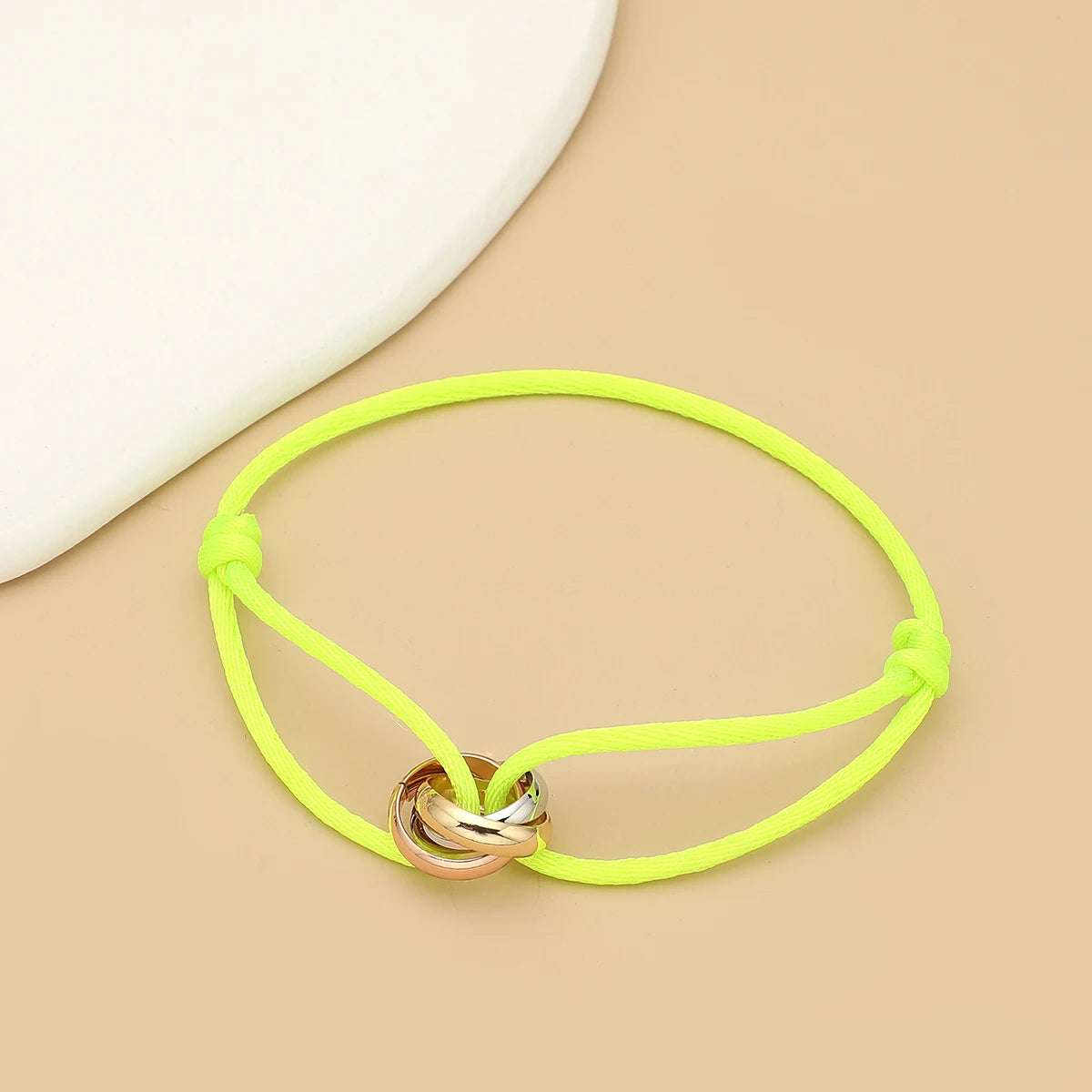Unisex Jelieora Venture bracelet with three metal round circles on adjustable rope in jewelry fashion style.