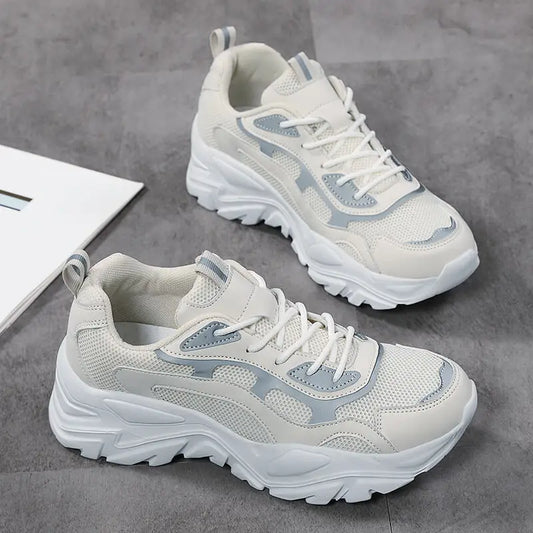 Women's vulcanised platform chunky sneakers by Jelieora Venture featuring black uppers, thick soles, and trendy sneaker design.