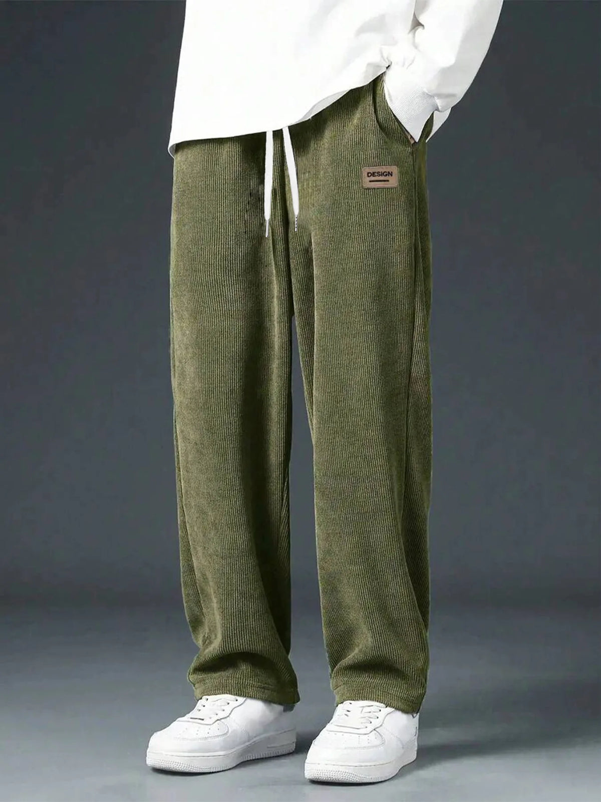 Men's straight leg corduroy trousers by Jelieora Venture with a classic fit and textured ribbed fabric, shown on a neutral background.