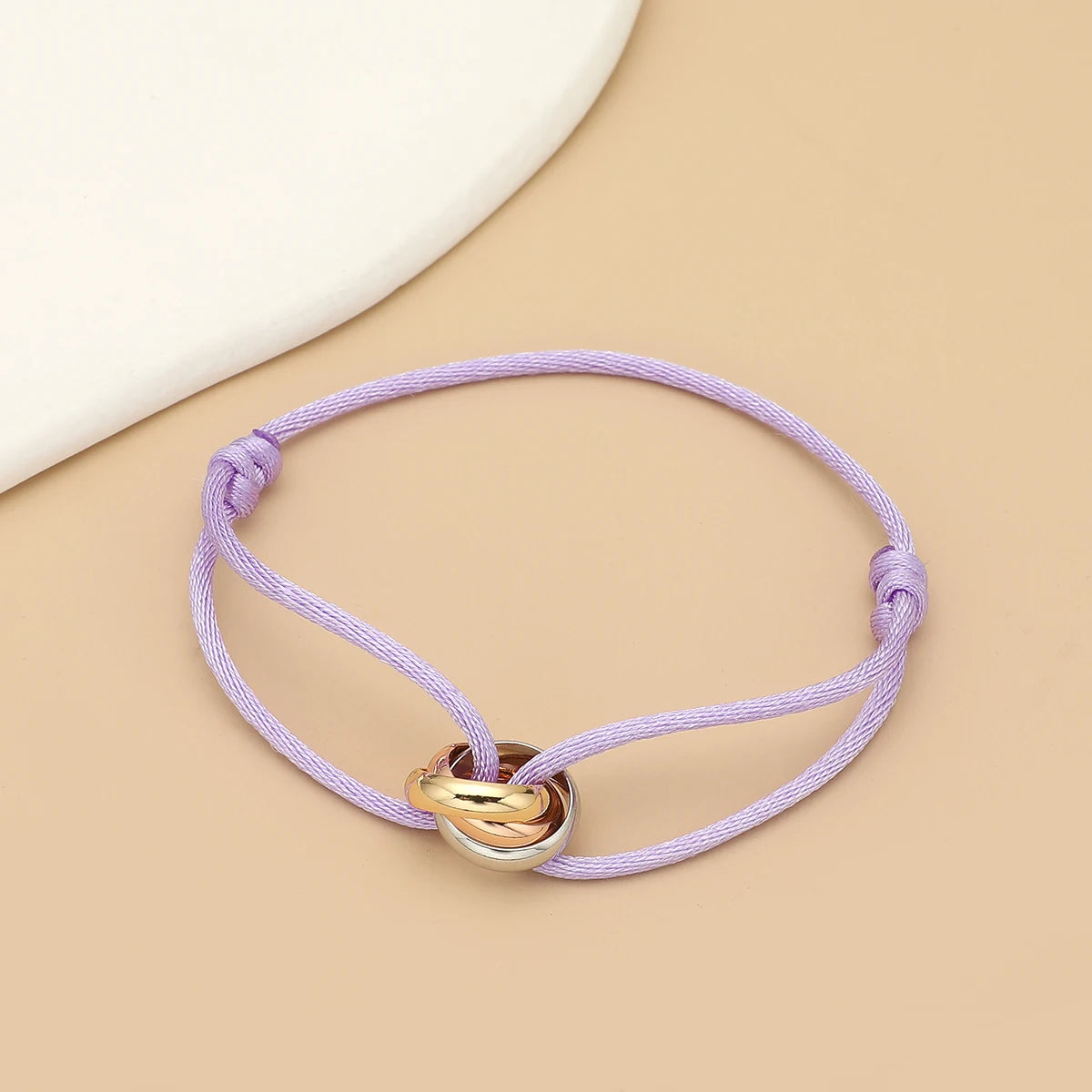Unisex Jelieora Venture bracelet with three metal round circles on adjustable rope, suitable for men and women jewelry.