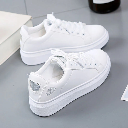 Women's embroidered floral lace-up trainers by Jelieora Venture featuring colorful floral embroidery and casual sneaker design.