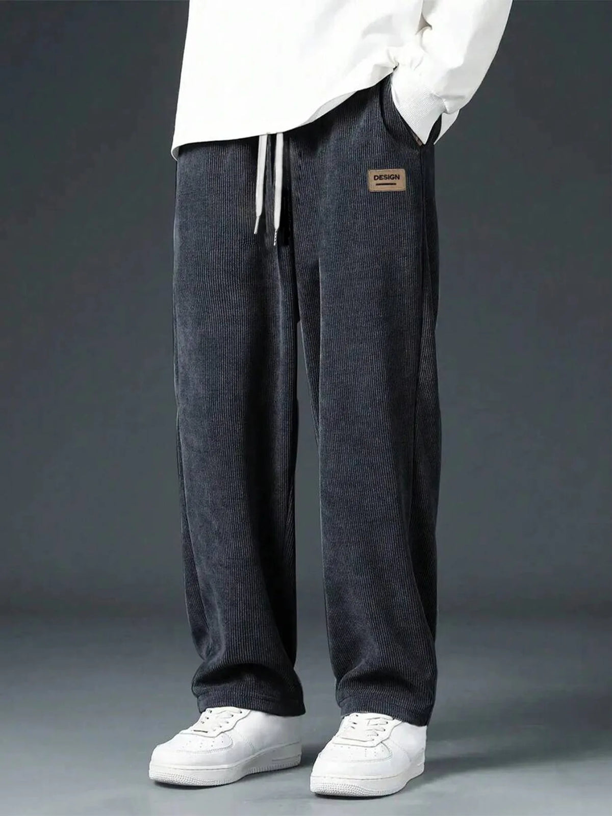 Men's straight leg corduroy trousers by Jelieora Venture showing navy blue fabric and classic fit with front pockets.