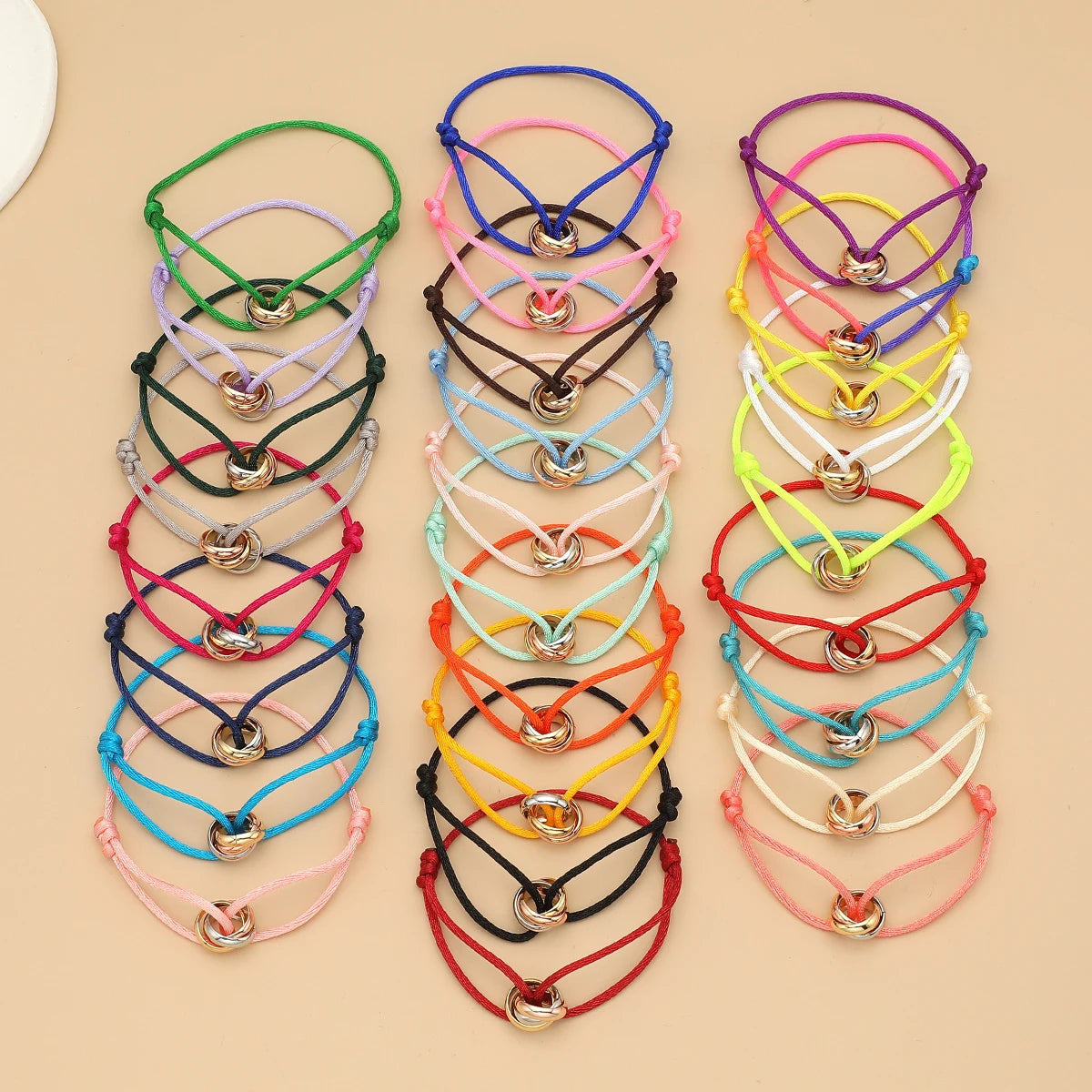 Unisex Jelieora Venture bracelet with three metal round circles on adjustable rope for men and women jewelry accessory.