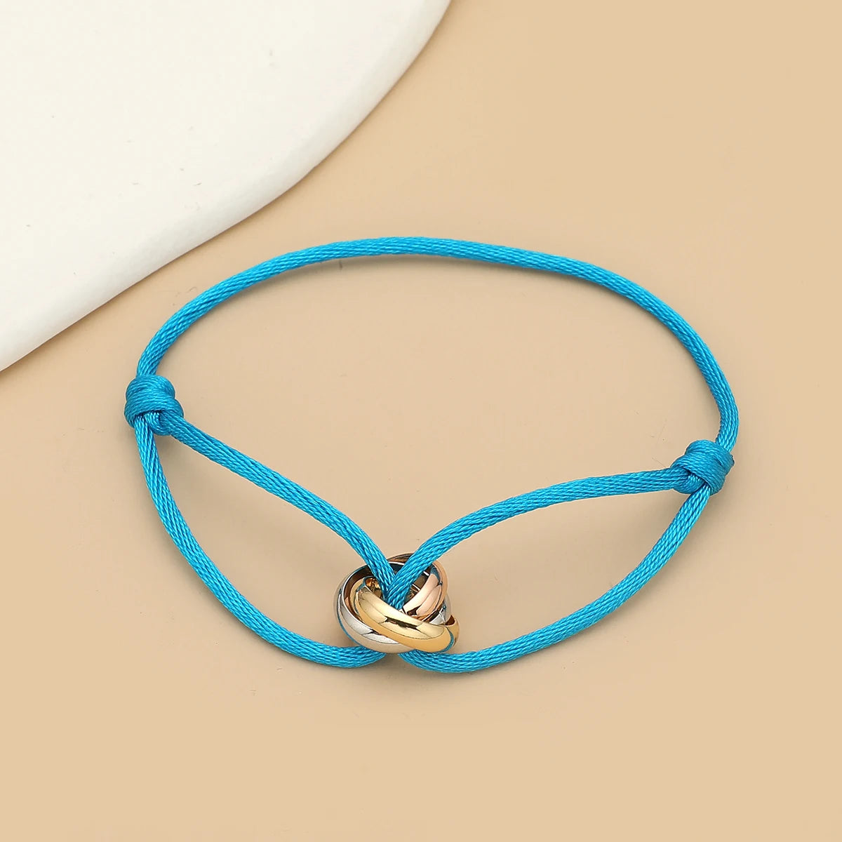 Simple fashion unisex bracelet by Jelieora Venture featuring three metal round circles on adjustable rope jewelry for men and women