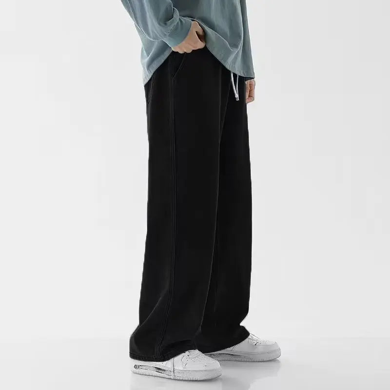 Men's Y2K low rise wide leg denim jeans by Jelieora Venture, showing the relaxed fit and classic denim texture.