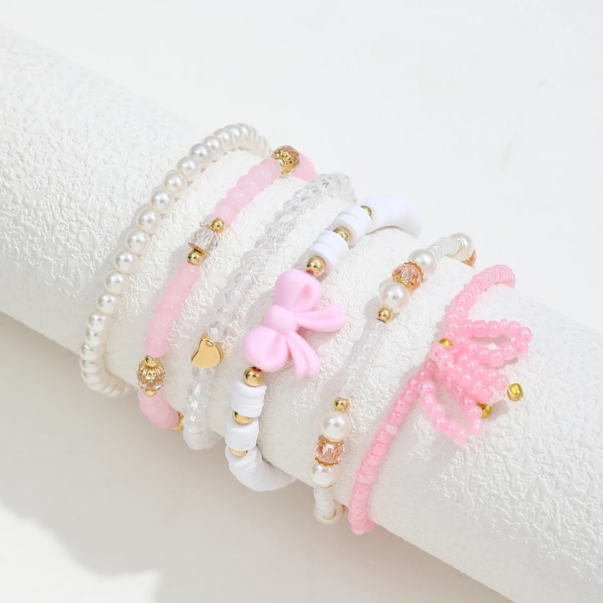 Set of six Jelieora Venture pearl love beaded bow bracelets for women, featuring cute, simple jewelry design with sweet charm.