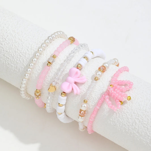 Set of six Jelieora Venture pearl love beaded bow bracelets for women, featuring cute, simple jewelry design with sweet charm.