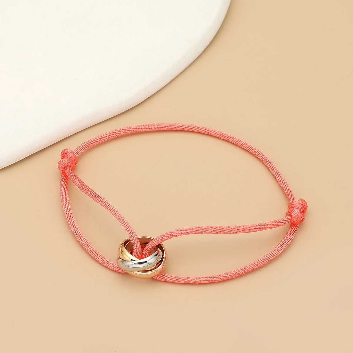 Simple fashion unisex bracelet by Jelieora Venture featuring three metal round circles on an adjustable rope design.