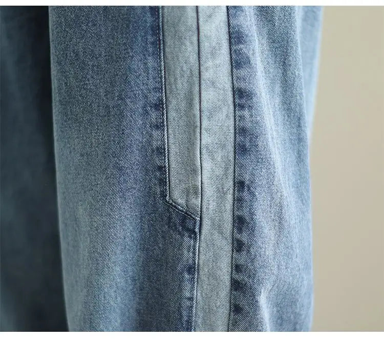 Women's denim harem pants by Jelieora Venture featuring a relaxed fit and stylish design on a neutral background.