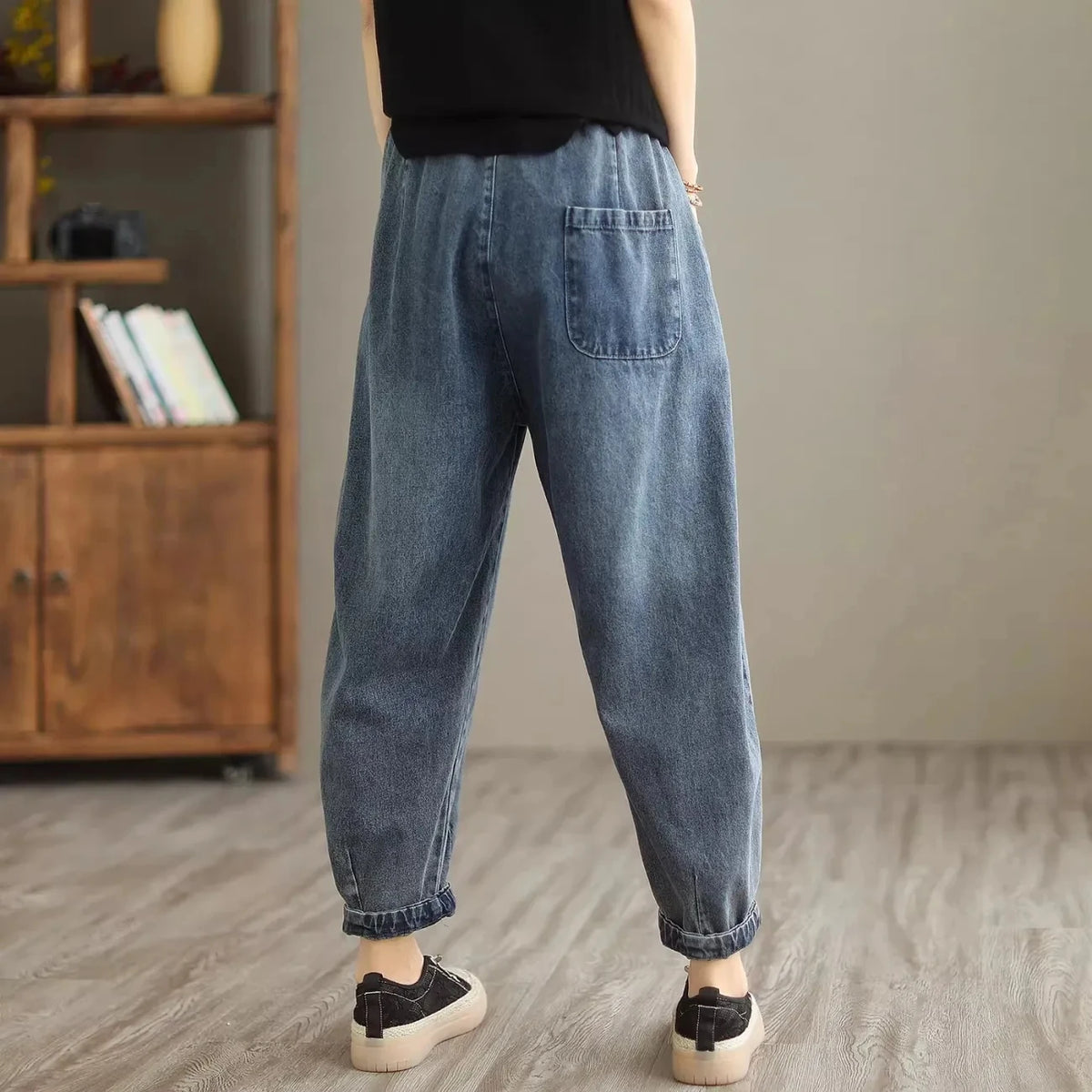 Women's denim harem pants by Jelieora Venture featuring a relaxed fit and stylish design, shown in a front view image.