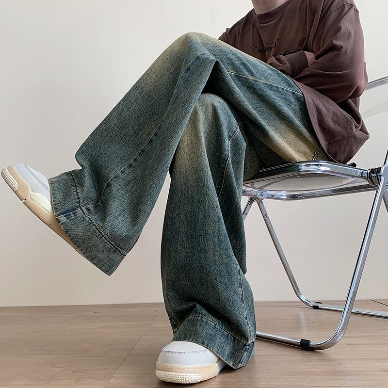 Men's distressed wide-leg baggy jeans by Jelieora Venture, featuring a relaxed fit and rugged distressed details.