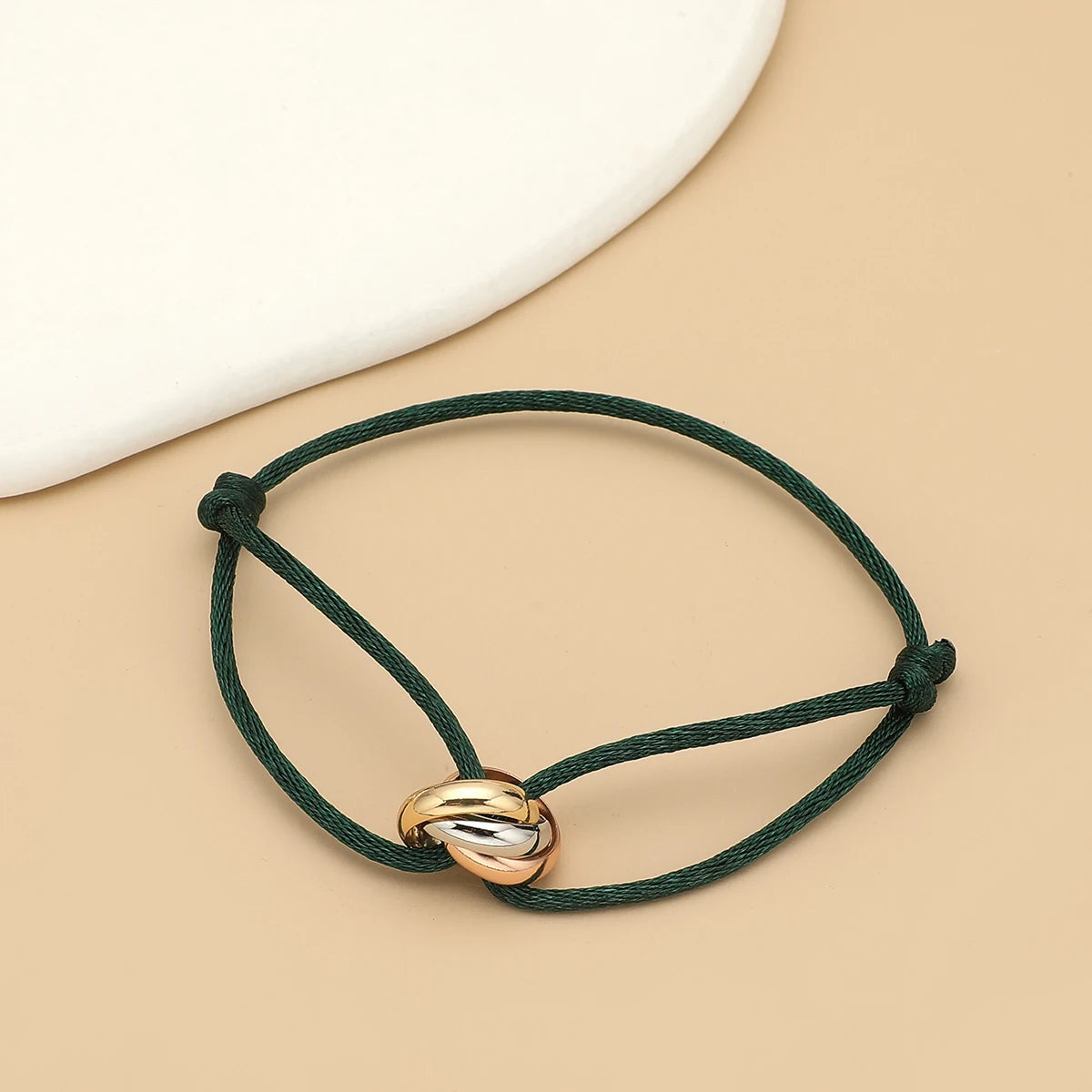 Simple fashion unisex bracelet by Jelieora Venture featuring three metal round circles on adjustable rope for men and women jewelry.