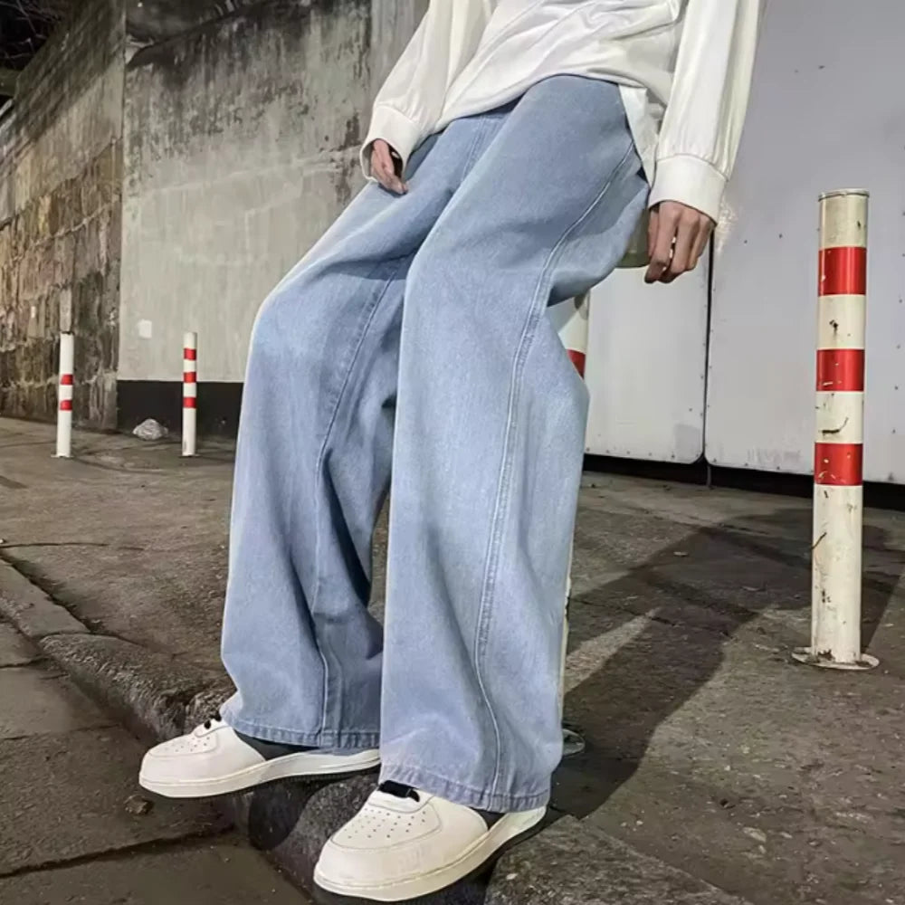 Men's baggy wide leg Y2K denim jeans by Jelieora Venture, showing the relaxed fit and classic blue denim fabric.