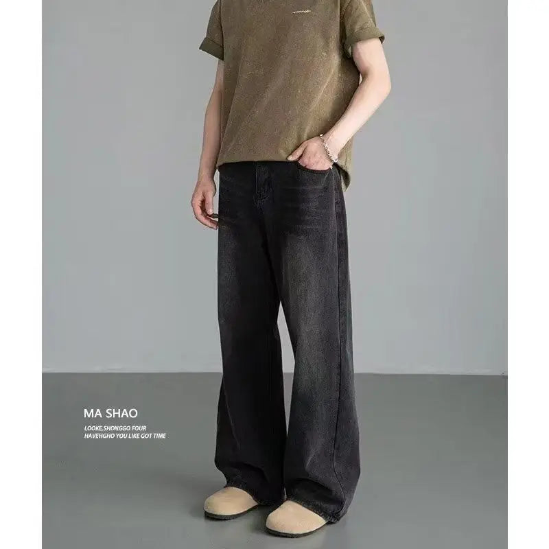 Men's distressed wide leg jeans by Jelieora Venture featuring ripped details and relaxed fit, shown on a model.