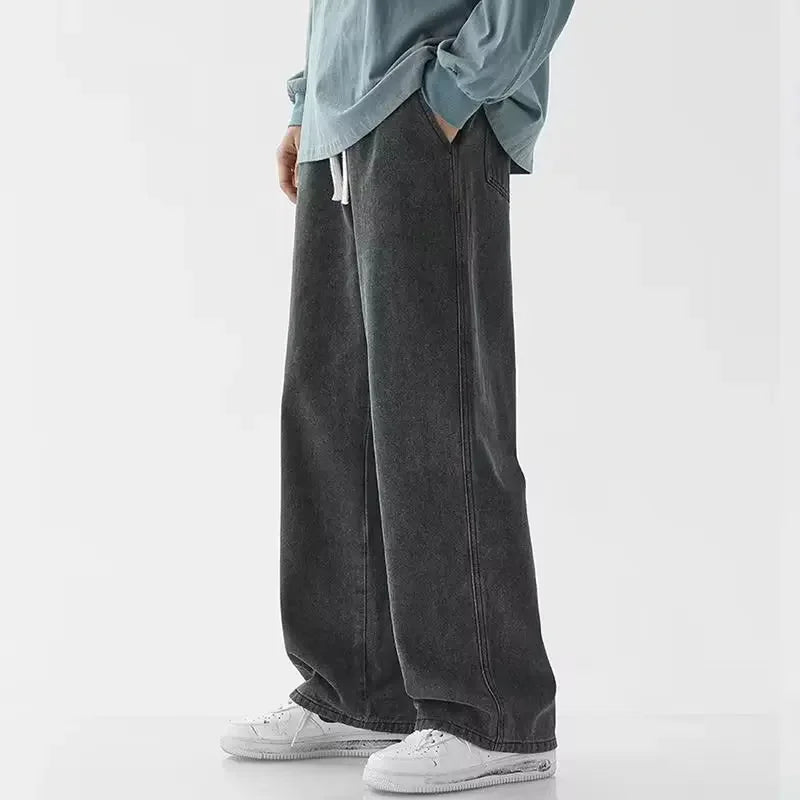 Men's baggy wide-leg Y2K denim jeans by Jelieora Venture, displayed with a relaxed fit and classic blue denim fabric.