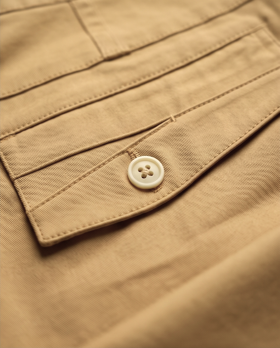 Beige slim-fit stretch chinos by PAMONI, showing the tailored fit and smooth fabric details.