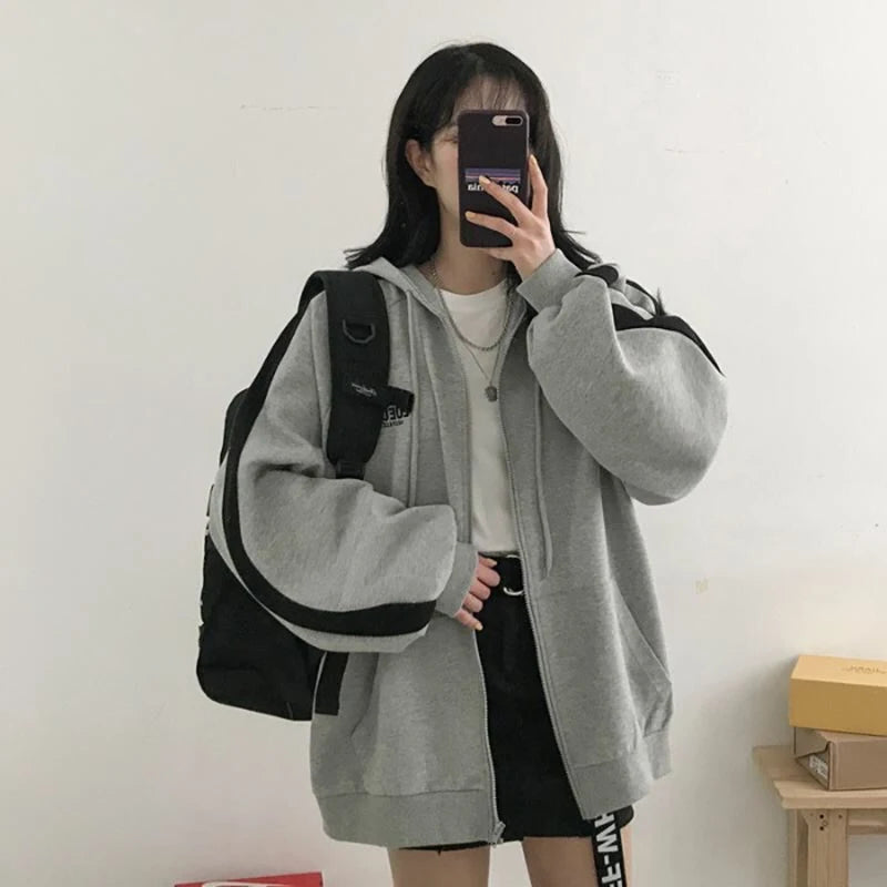 Women's oversized Harajuku fleece hoodie sweatshirt by Jelieora Venture, shown in soft, cozy fabric with a relaxed fit and stylish design.