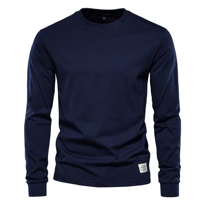 Men's cotton long sleeve T-shirt by Jelieora Venture, shown in a neutral color with a relaxed fit on a model.