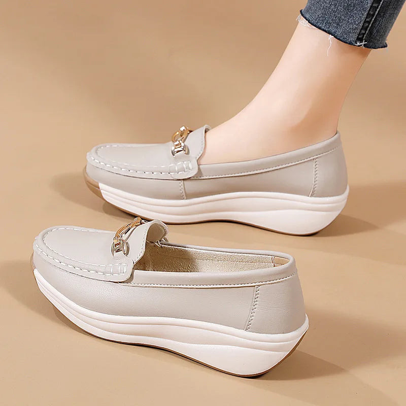 Women's suede mule clogs with cork soles from Jelieora Venture, showcasing their stylish and comfortable footwear design.