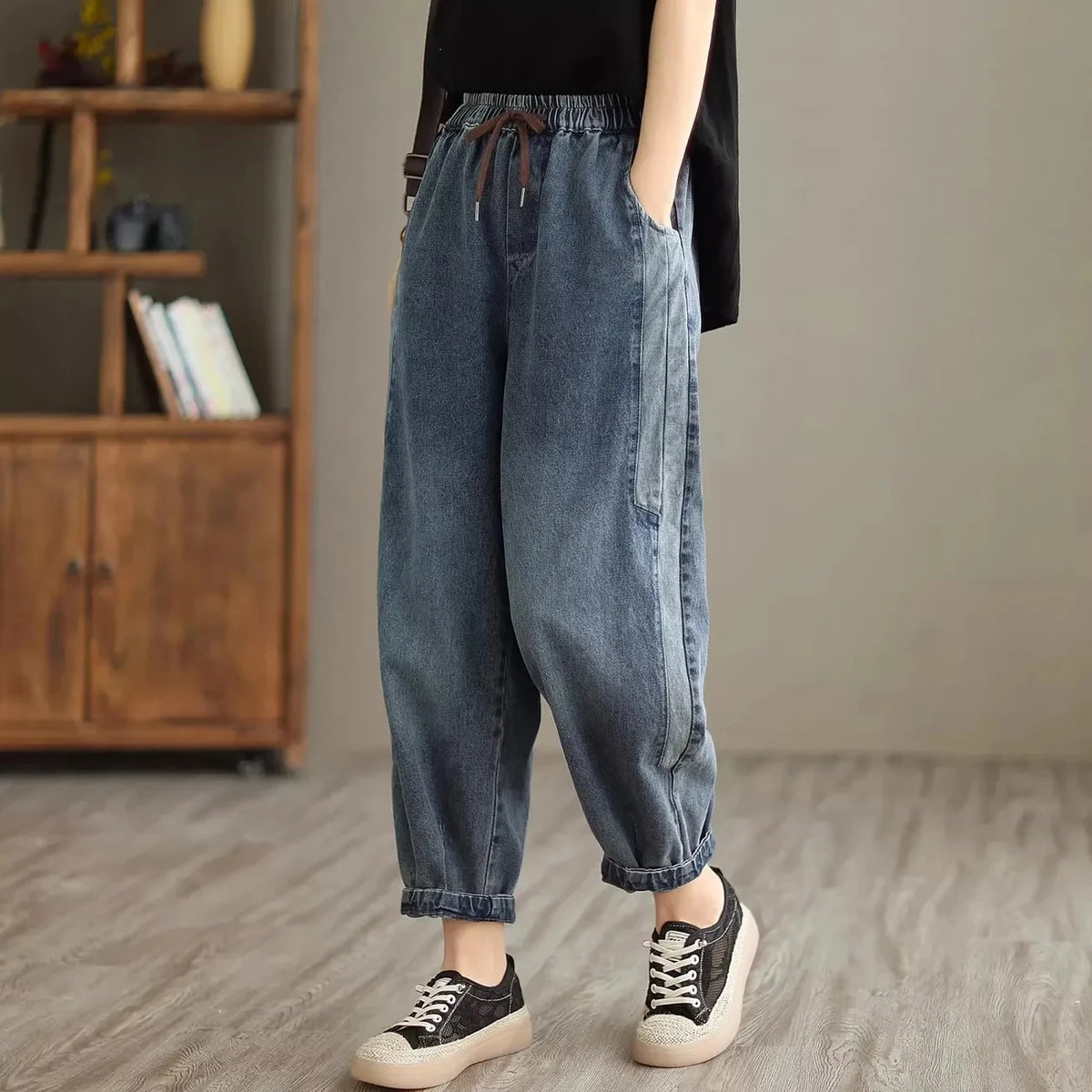 Women's denim harem pants by Jelieora Venture, showcasing relaxed fit with tapered legs and elastic waist, in a stylish denim fabric.