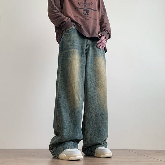 Men's distressed wide leg baggy jeans by Jelieora Venture, showing the relaxed fit and distressed details on casual bottoms.