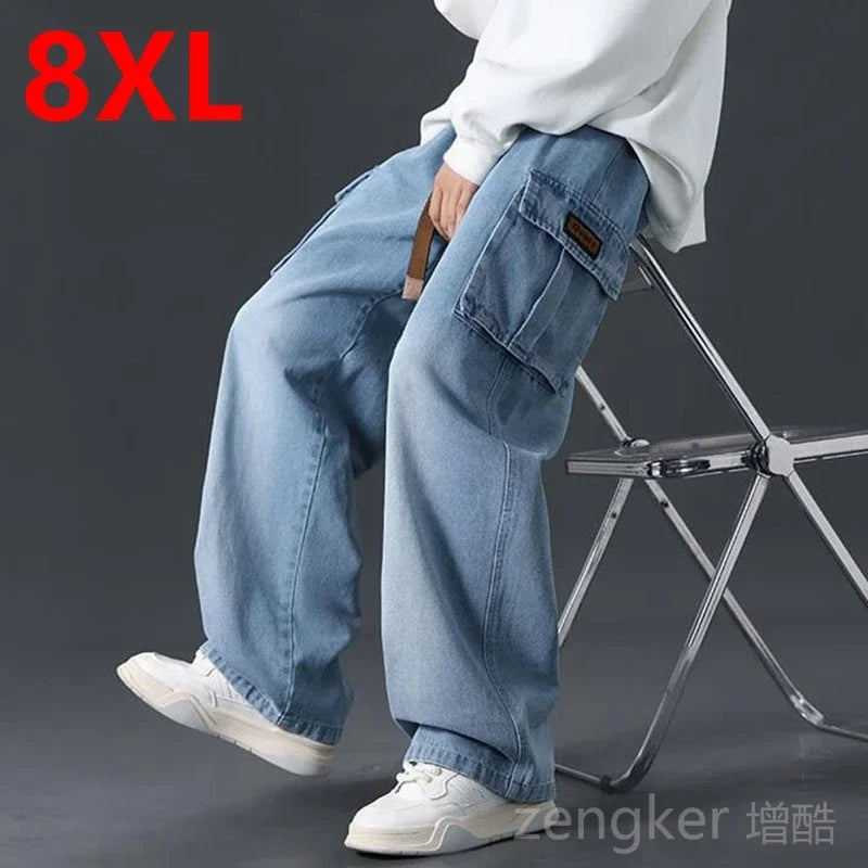 Men's plus size loose wide-leg jeans from Jelieora Venture with elasticated waist, shown hanging with a relaxed fit.