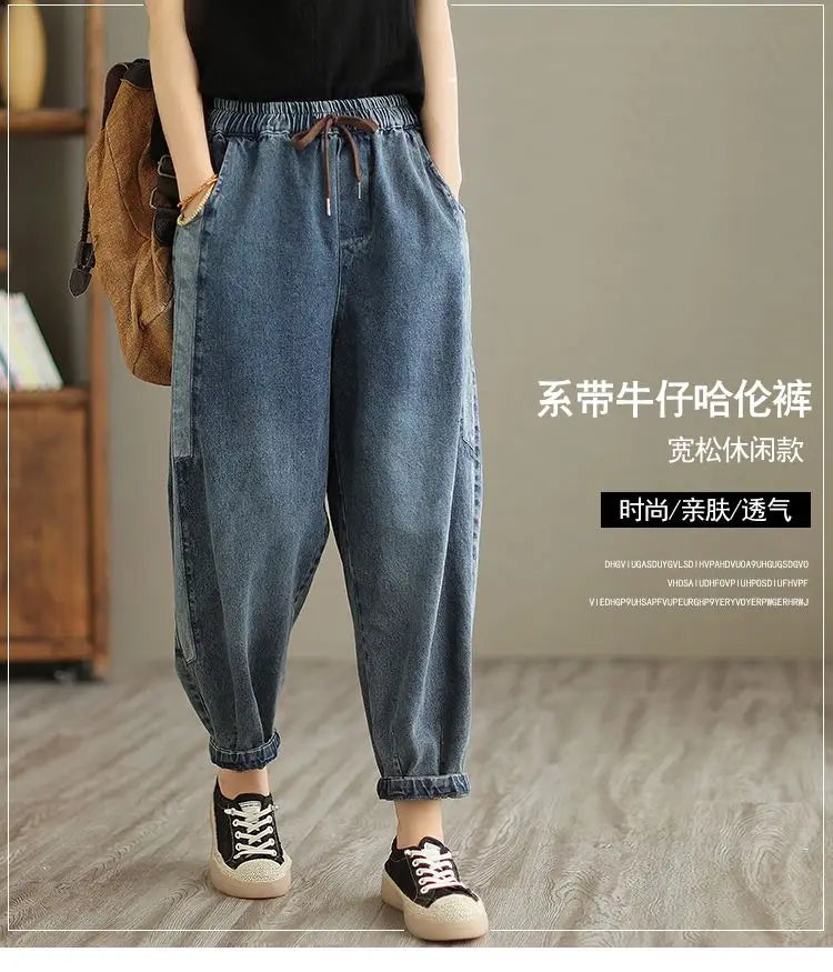 Women's denim harem pants by Jelieora Venture featuring a relaxed fit and stylish design, shown on a model.