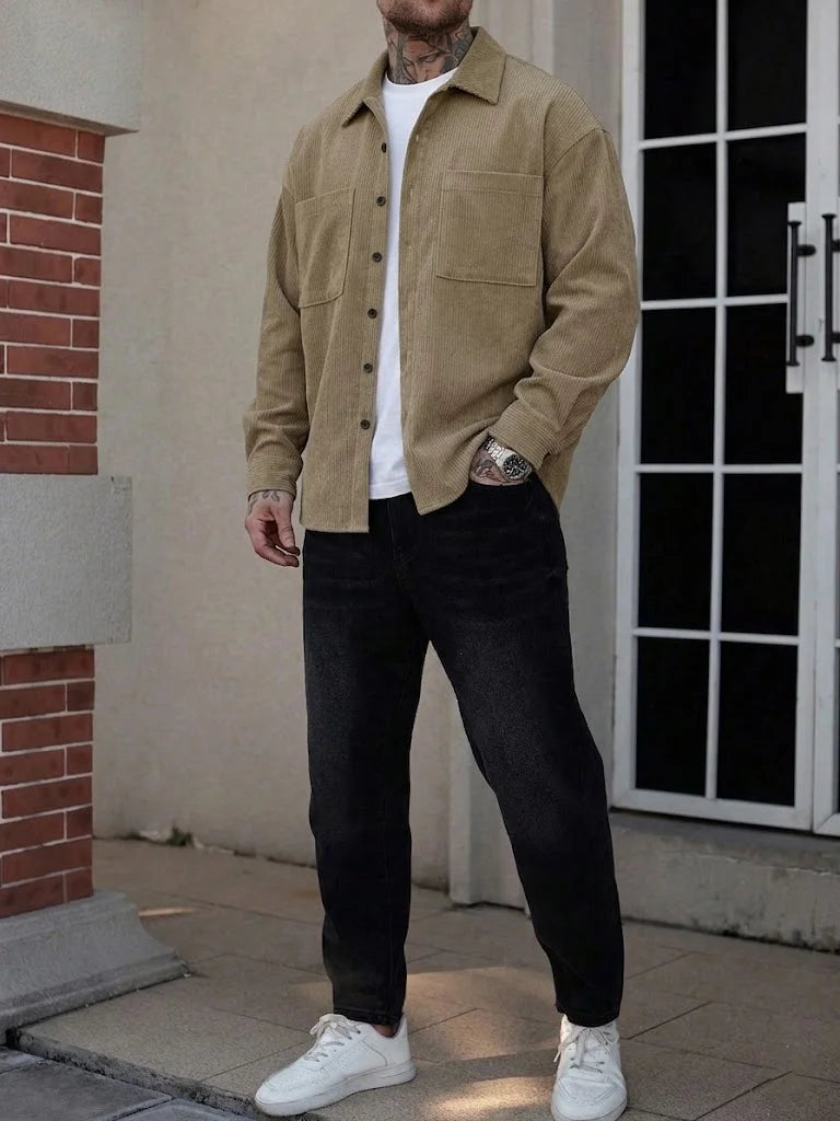 Men's corduroy shirt jacket by Jelieora Venture, shown in a stylish, close-up view highlighting the textured fabric and button details.