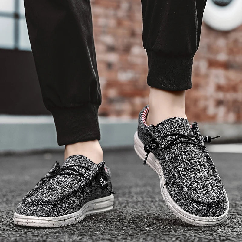 Men's denim canvas trainers by Jelieora Venture featuring casual style, white rubber soles, and navy denim fabric.