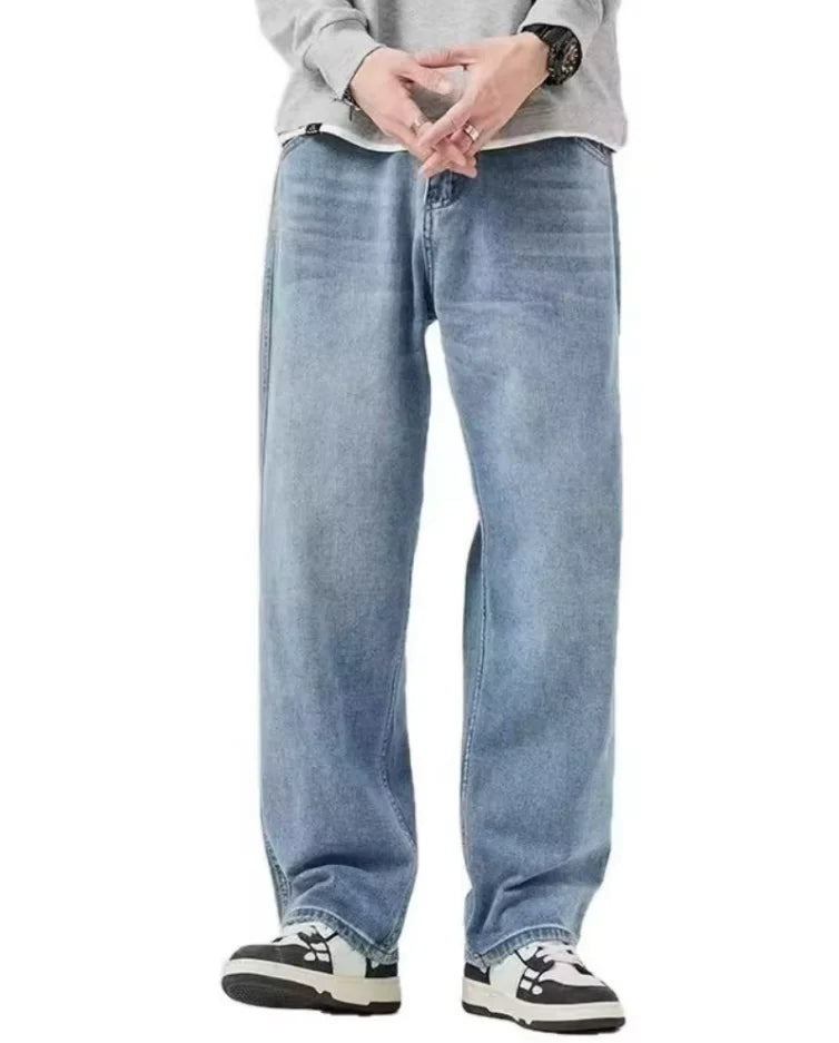 Men's distressed wide leg jeans by Jelieora Venture featuring a relaxed fit and ripped detailing on denim fabric.