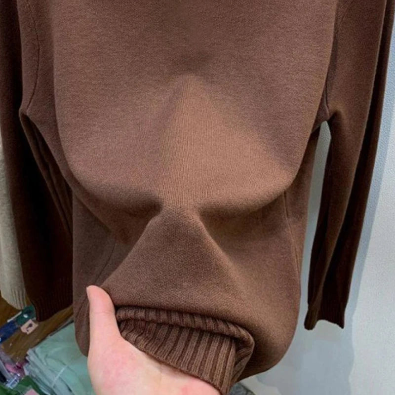 Women's turtleneck knit pullover sweater by Jelieora Venture, featuring a cozy, fitted design in soft, ribbed fabric.