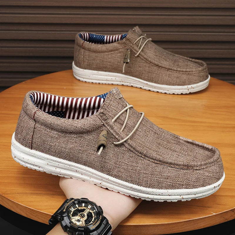 Men's denim canvas trainers by Jelieora Venture with white rubber soles and laced-up design, showcasing casual footwear style.