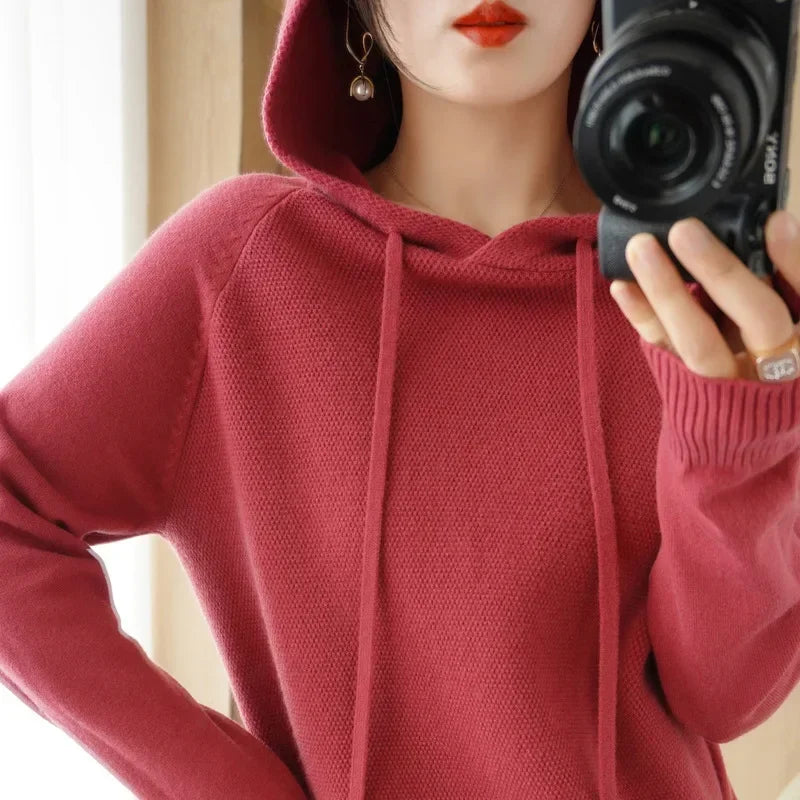 Women's knitted hoodie jumper by Jelieora Venture, featuring a cozy, soft fabric and a relaxed fit, shown in a stylish design.