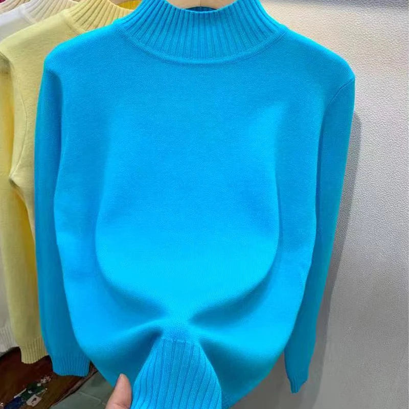 Women's turtleneck knit pullover sweater by Jelieora Venture, featuring a cozy, fitted design in soft yarn.