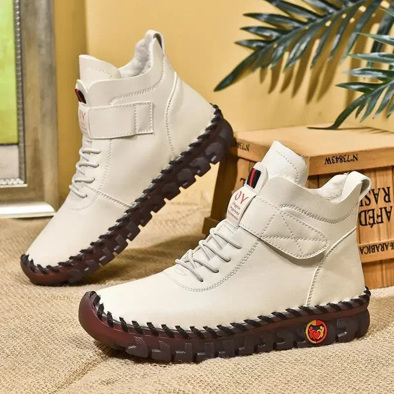 Women's waterproof ankle snow boots with faux fur lining by Jelieora Venture, featuring durable waterproof material and cozy interior.