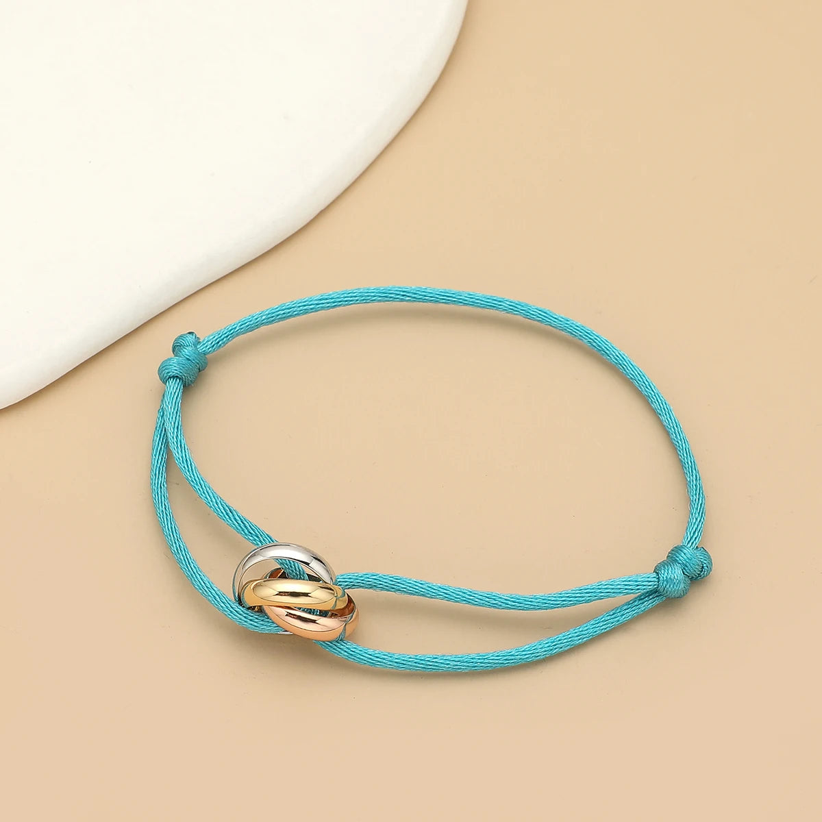 Simple fashion unisex bracelet with three metal round circles, adjustable men's rope jewelry by Jelieora Venture.