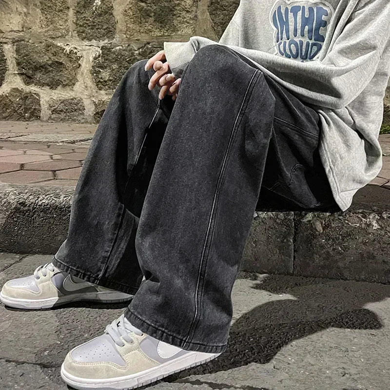 Men's wide leg streetwear jeans by Jelieora Venture shown on a model, featuring a relaxed fit and classic denim style.