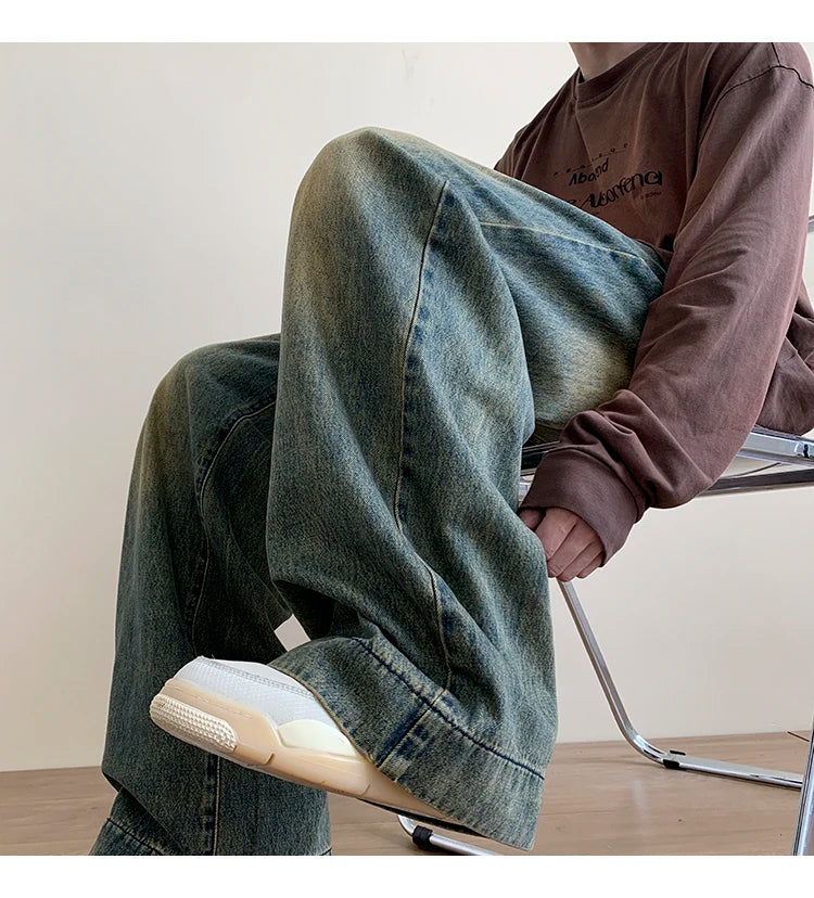 Men's distressed wide-leg baggy jeans from Jelieora Venture featuring a relaxed fit and distressed detailing.