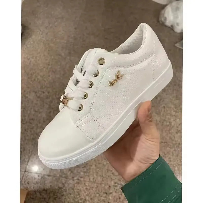 Women's lace-up vulcanized flat sneakers by Jelieora Venture, showing the stylish black shoes with white rubber soles.