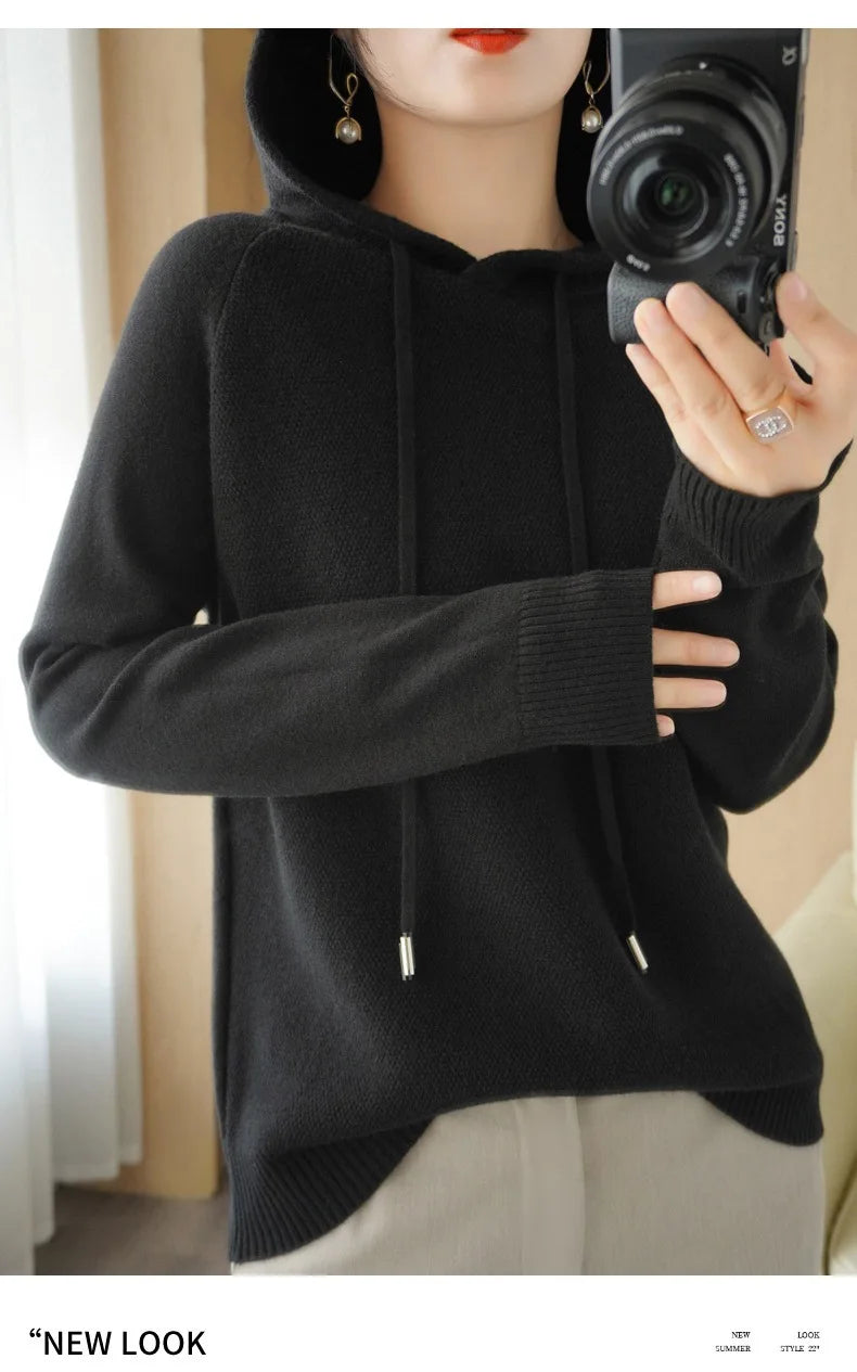 Women's knitted hoodie jumper by Jelieora Venture featuring a cozy, stylish design with a front pocket and drawstring hood.