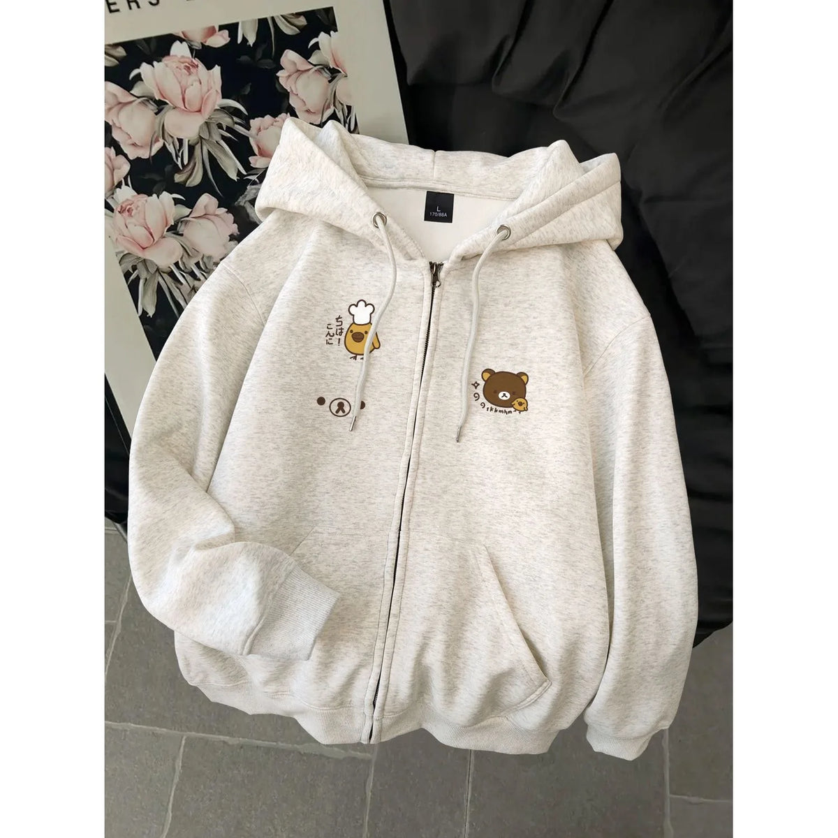 Women's dog print zip hoodie by Jelieora Venture featuring a cozy design with a playful dog pattern and a front zipper closure.