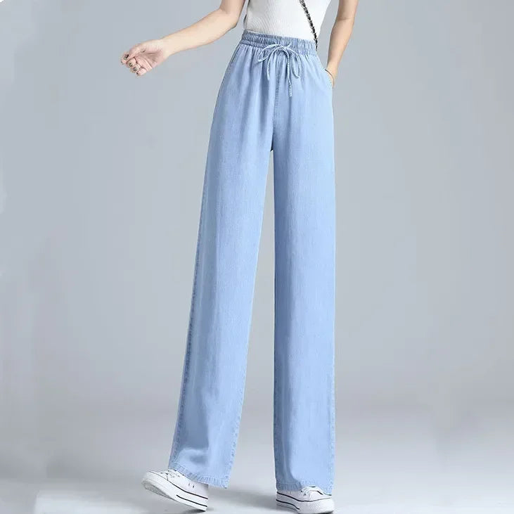 Women's high waist wide leg jeans by Jelieora Venture, showcasing a relaxed fit and stylish denim with front pockets.
