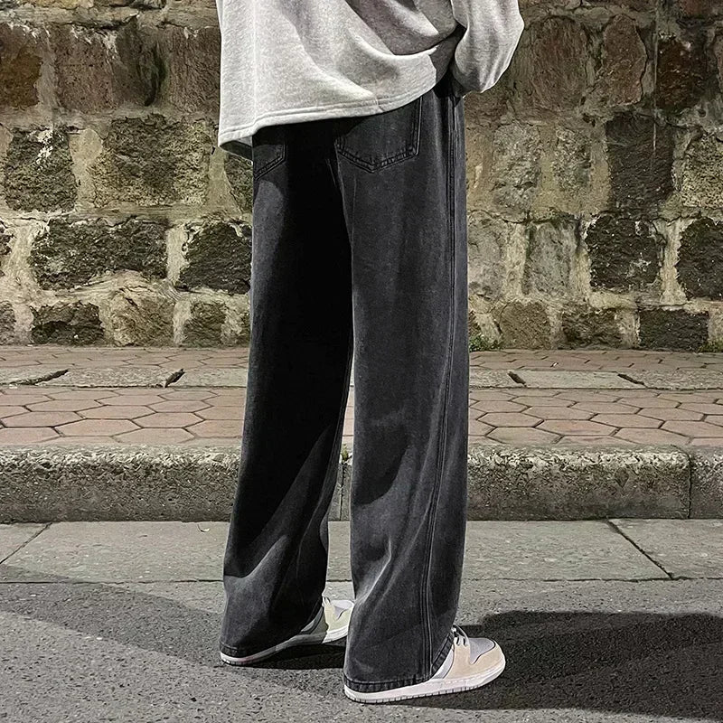 Men's wide-leg streetwear jeans by Jelieora Venture, showing the relaxed fit and stylish design on a model.