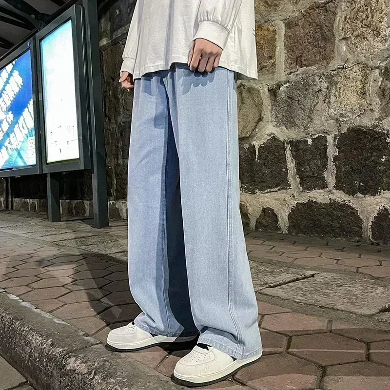Men's wide leg streetwear jeans by Jelieora Venture, shown in dark denim with a relaxed fit and classic five-pocket design.
