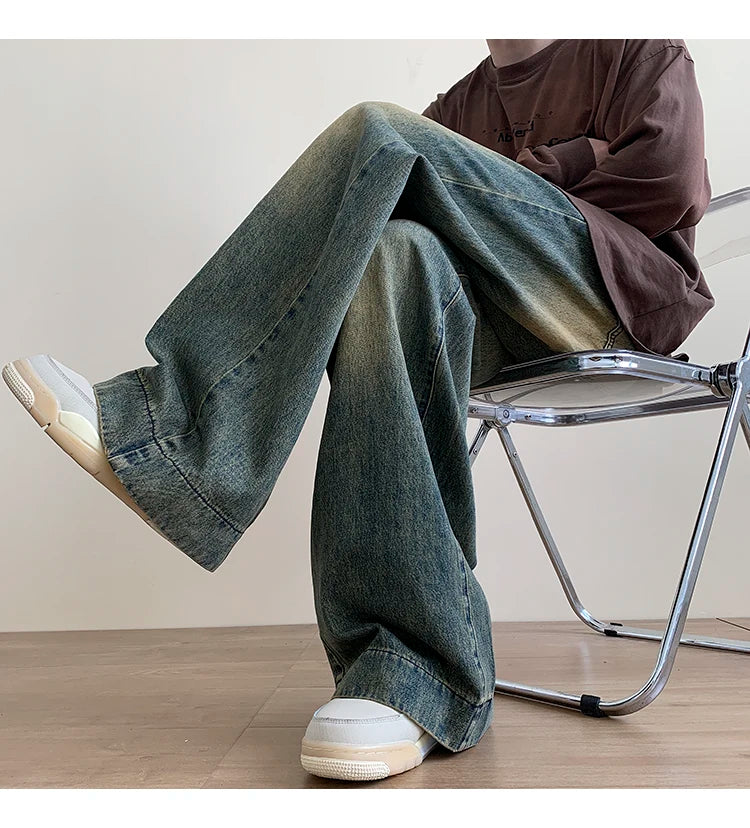 Men's distressed wide leg baggy jeans by Jelieora Venture, showing the relaxed fit, distressed details, and casual style.