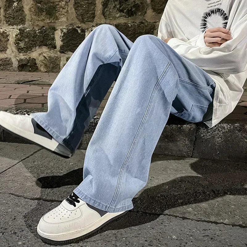 Men's wide-leg streetwear jeans by Jelieora Venture, shown in a relaxed fit with classic denim texture and stylish design.